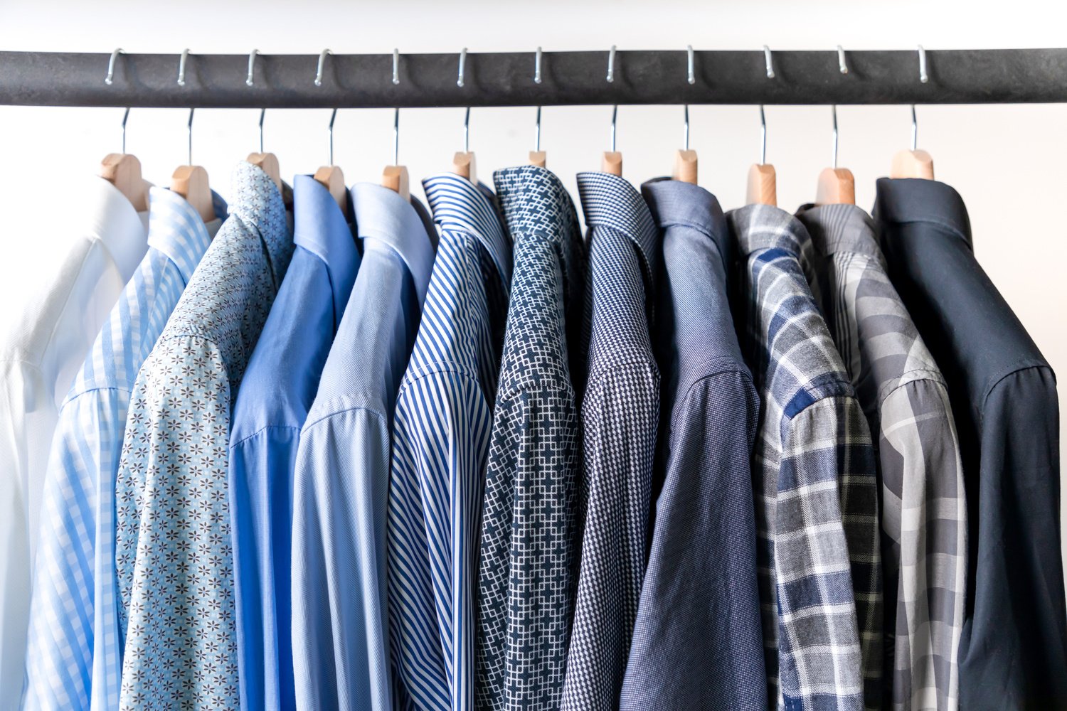 Row of Men's Shirts in Blue Colors on Hanger